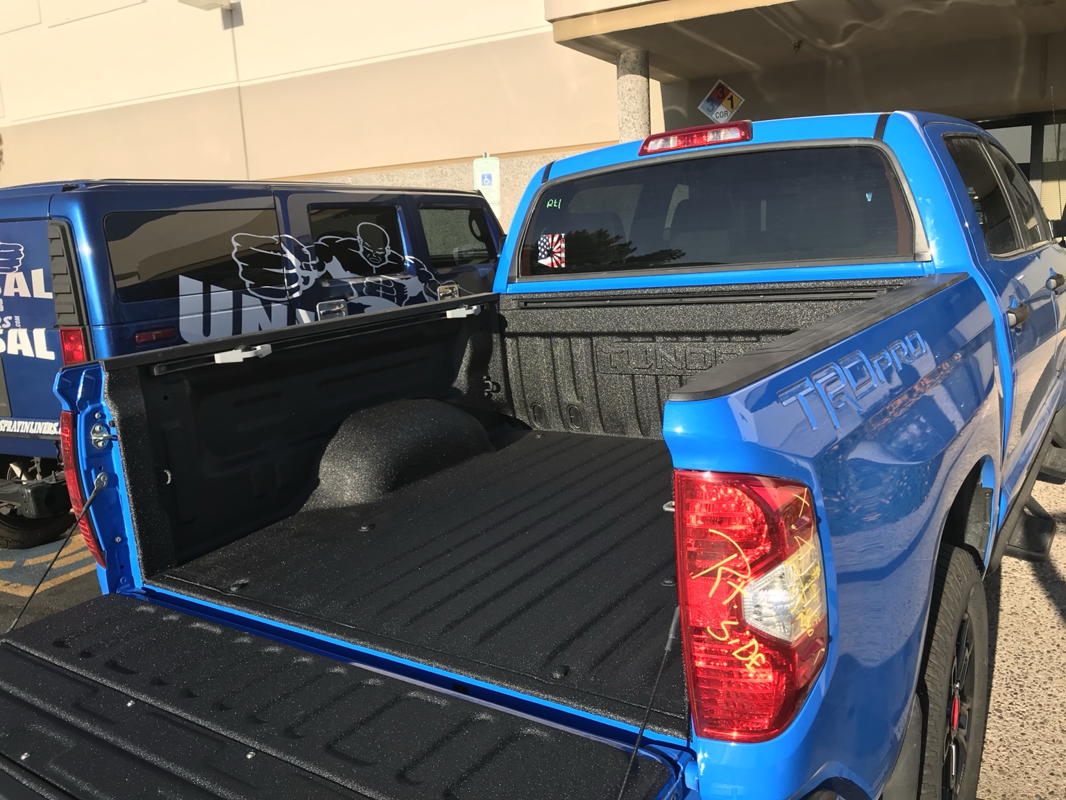 Blue pickup with bedliner
