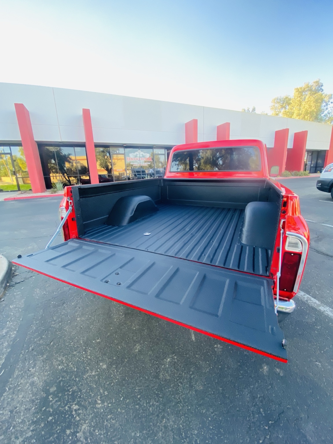Freshly coated red pickup bed